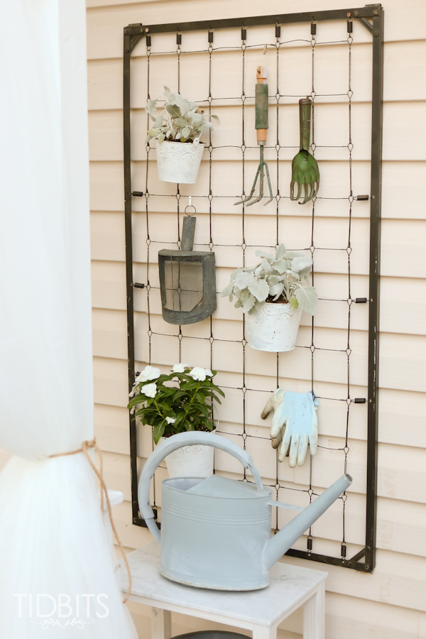 Repurposed crib garden tool hanger